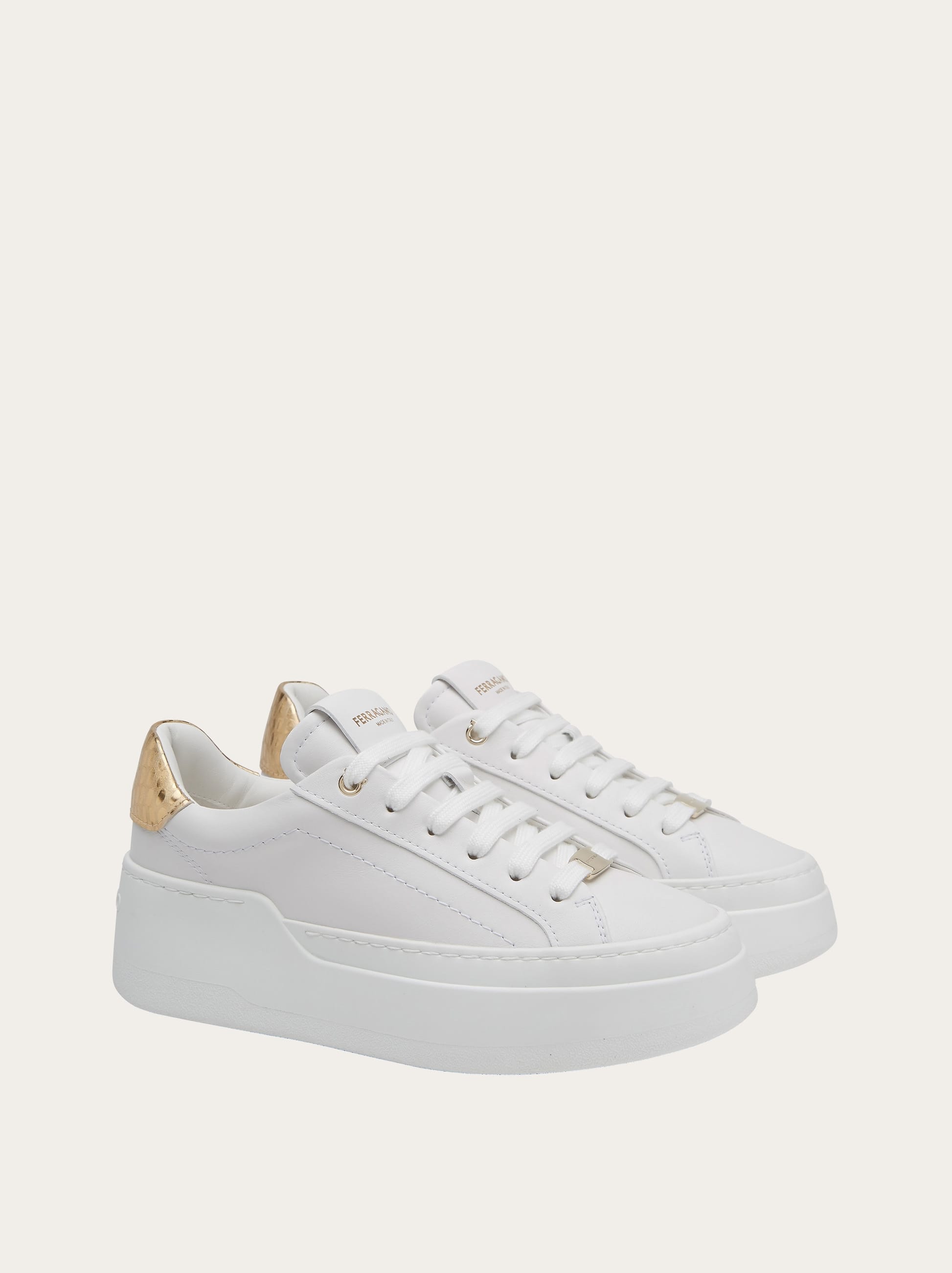 Shop Ferragamo Wedge Sneaker In White